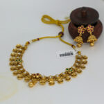 Antique Gold Kundan Necklace with Floral Motifs and Jhumka Earrings - Image 3