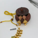 Antique Gold Kundan Necklace with Floral Motifs and Jhumka Earrings - Image 2